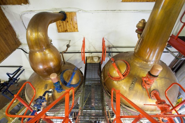 The Wash Still (right) and Spirit Still (left) at Edradour distillery clearly show the difference in size which is common of a two-still distilling system. 